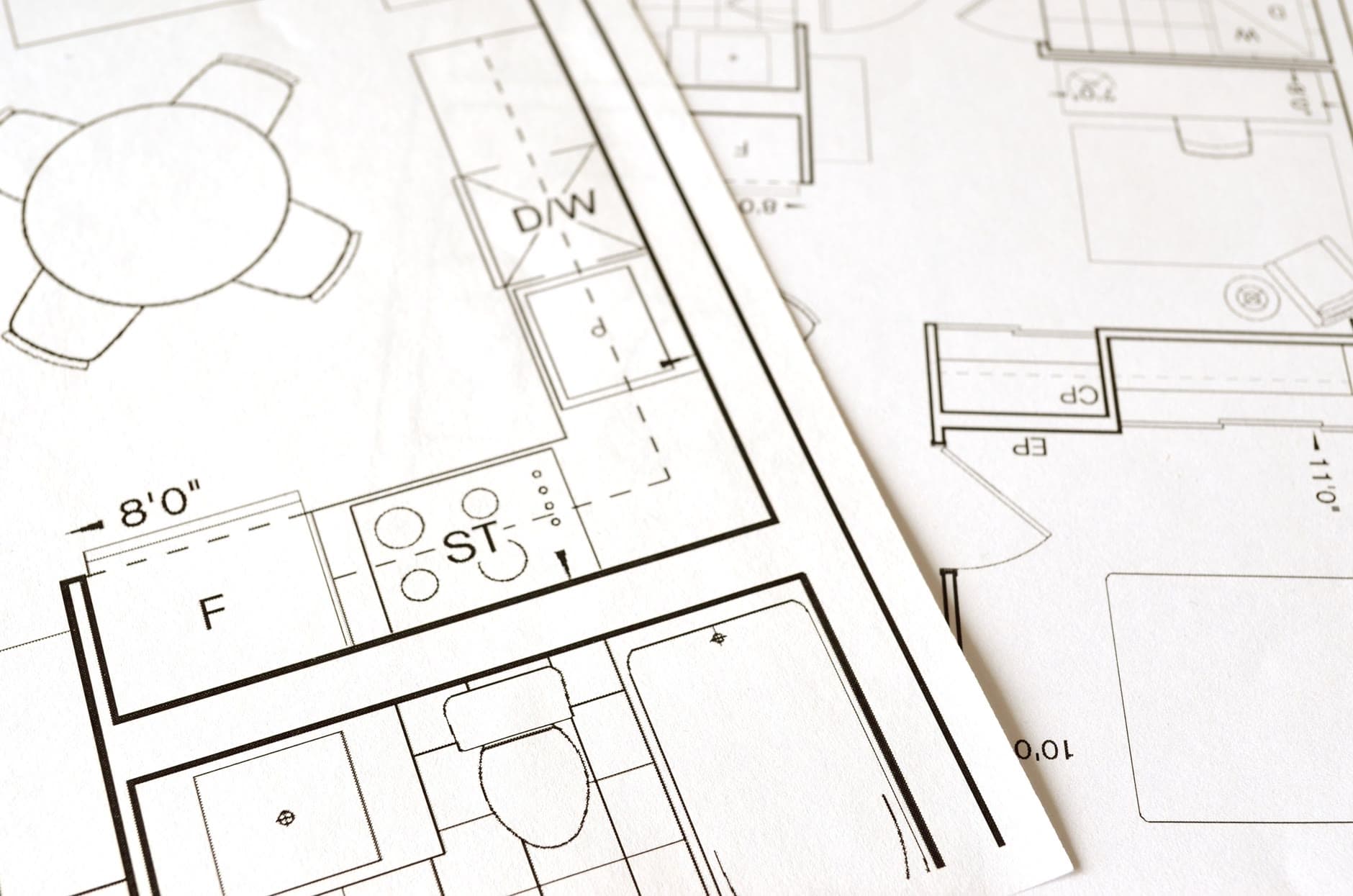 Printed residential floor plan showing kitchen, bath, and closet dimensions, the drawing a spec sheet is written against